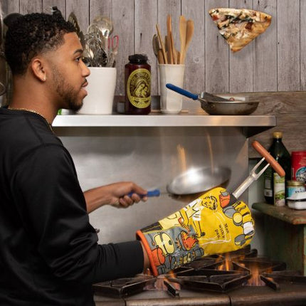 Man With A Pan Oven Mitt- being used