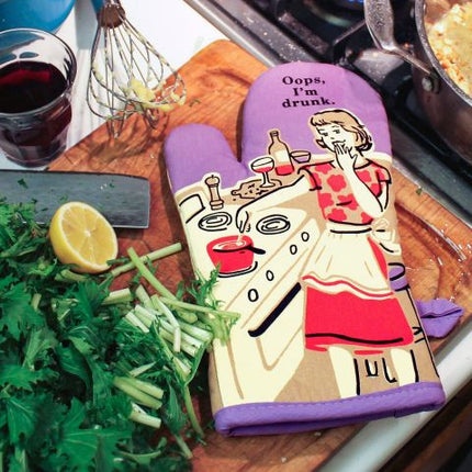 Oops, I'm Drunk Oven Mitt- on counter with cooking supplies