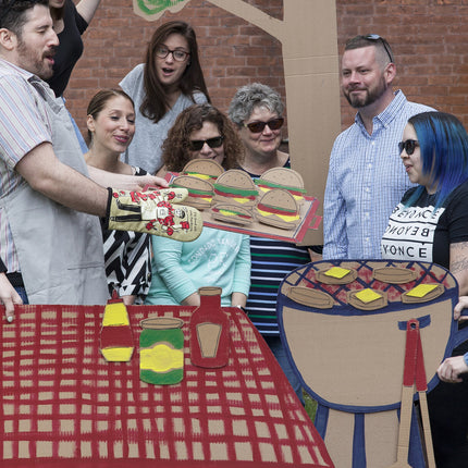 Feed All You Fuckers Oven Mitt- at barbeque table setting