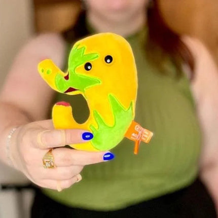 acid reflux plushie held by model