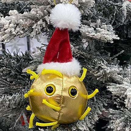 Golden covid ornament wearing a santa hat