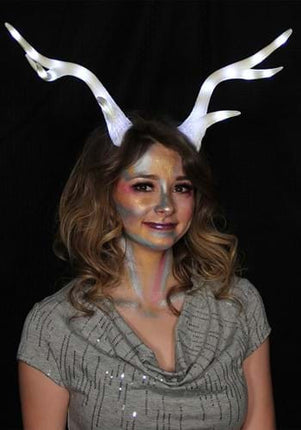 Light-Up Deer Antler White LumenHorns- glowing antlers worn by female model