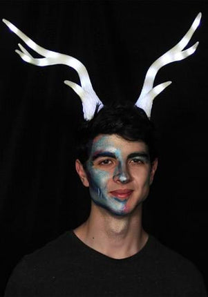 Light-Up Deer Antler White LumenHorns- glowing antlers worn by male model
