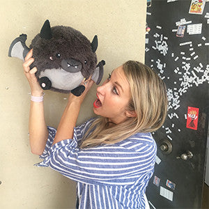 Mini Squishable Happy Bat- held by model