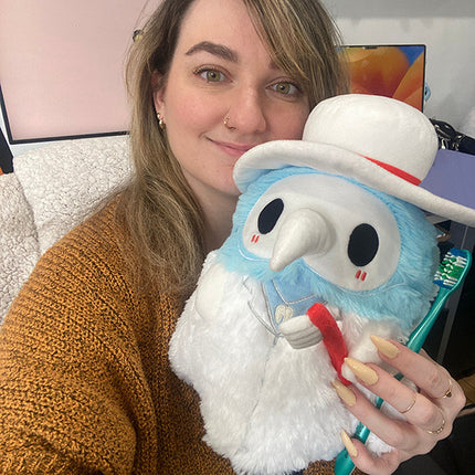 Mini Squishable Dr. Plaque, DMD- held by model