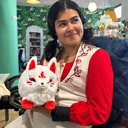 Mini Squishable Baby Kitsune- held by model
