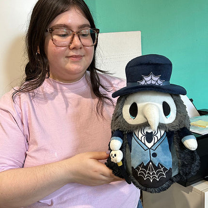Mini Squishable Haunted Plague Doctor- held by model