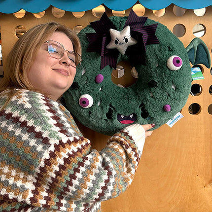 Squishable Spooky Wreath- held by model