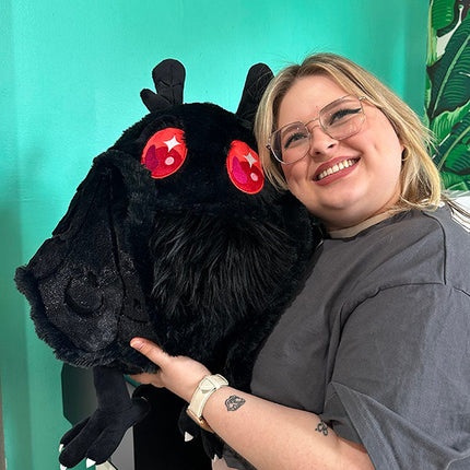 Squishable Baby Mothman- held by model