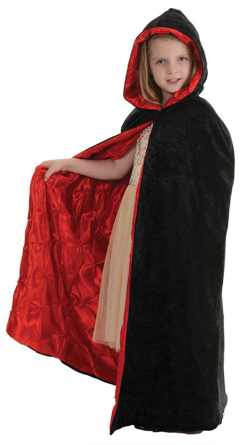 Your little witch or vampire will look great in this cape! Black velvet cape with red pin-tuck lining. One size fits most.